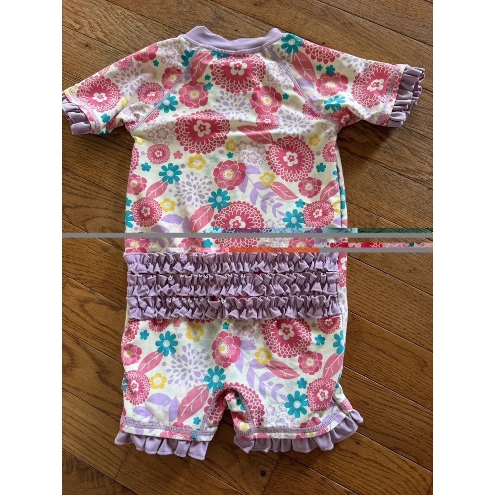 RuffleButts girls' short-sleeve one-piece rash guard swimsuit floral 2T vacation
